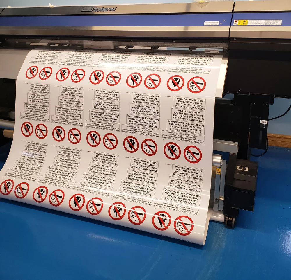 Safety warning decals being printed in the shop