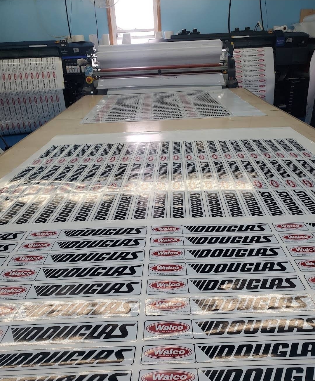 Douglas and Walco decal sheets on a production table